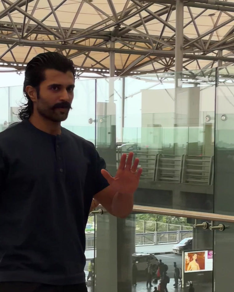 Vijay Deverakonda at the airport in the RWDY Grain Henley Tee, Deep Indigo